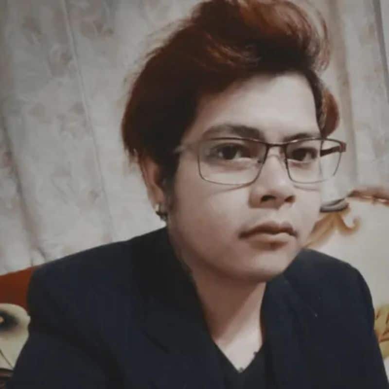 a person with glasses looking at the camera